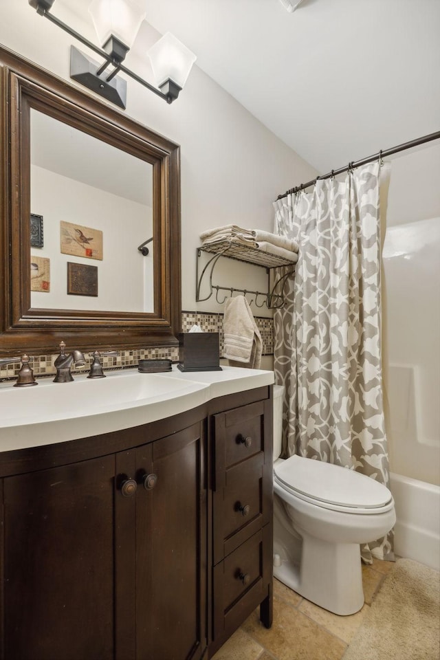 full bathroom with vanity, toilet, and shower / bath combo