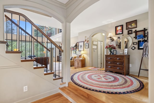 entrance foyer featuring hardwood / wood-style flooring and a healthy amount of sunlight