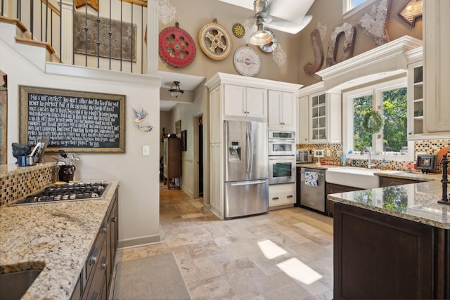 kitchen with plenty of natural light, stainless steel appliances, and tasteful backsplash