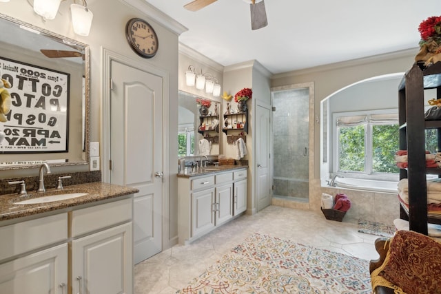 bathroom with vanity, tile patterned floors, crown molding, ceiling fan, and shower with separate bathtub