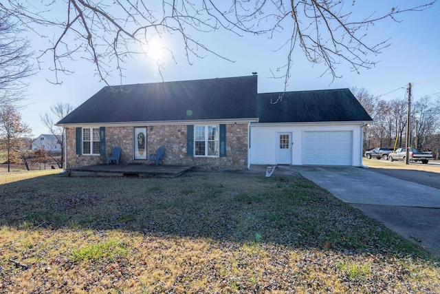 view of front of house with a garage and a front lawn