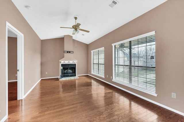 unfurnished living room with ceiling fan, lofted ceiling, and hardwood / wood-style flooring