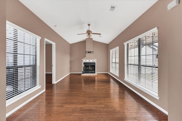 unfurnished living room with dark hardwood / wood-style floors, ceiling fan, and lofted ceiling