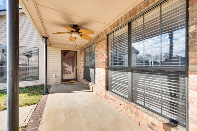 doorway to property featuring ceiling fan