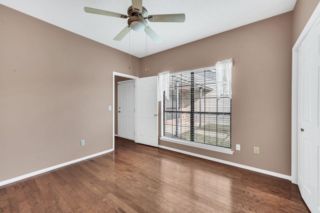 unfurnished bedroom featuring ceiling fan and hardwood / wood-style floors