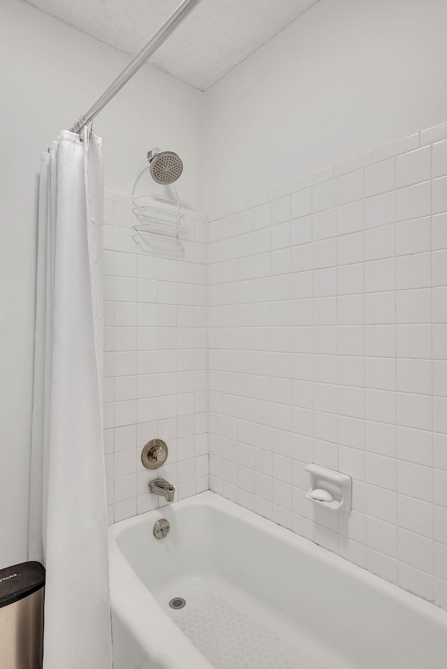 bathroom with shower / bath combo