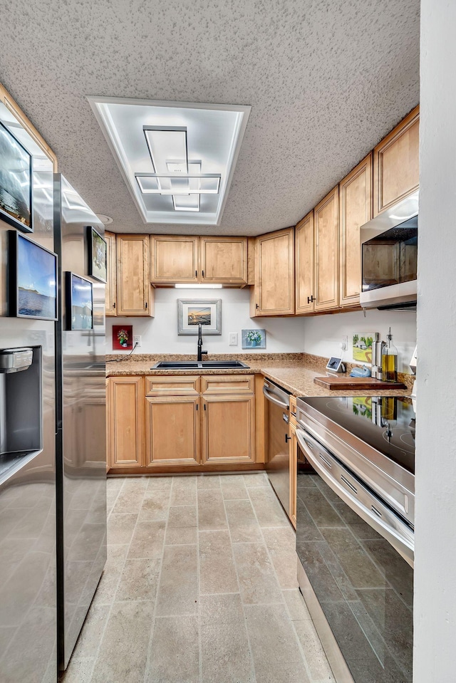 kitchen featuring stainless steel appliances and sink