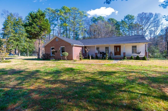 single story home featuring a porch and a front lawn