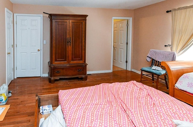 bedroom featuring dark hardwood / wood-style floors