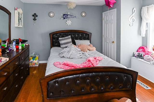 bedroom featuring dark wood-type flooring