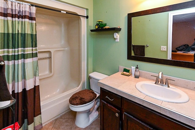 full bathroom featuring vanity, toilet, tile patterned flooring, and shower / bath combo