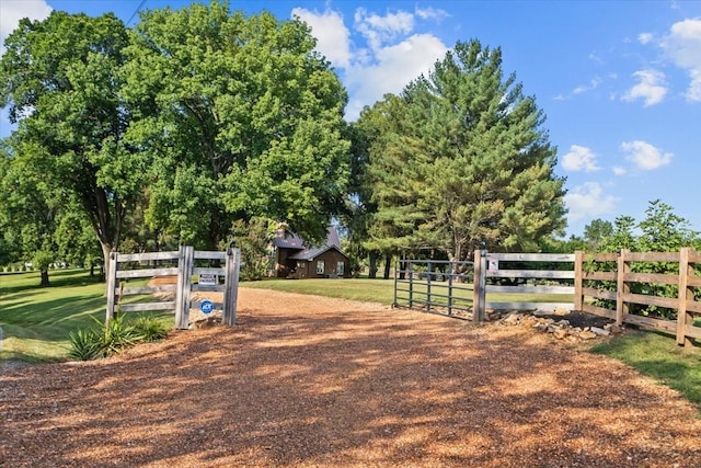 view of gate featuring a lawn