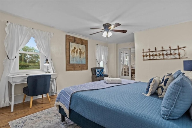 bedroom featuring hardwood / wood-style flooring and ceiling fan