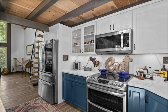 kitchen with dark hardwood / wood-style flooring, beamed ceiling, blue cabinets, white cabinets, and appliances with stainless steel finishes