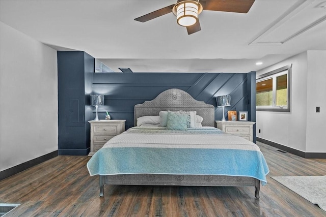 bedroom featuring ceiling fan and dark wood-type flooring