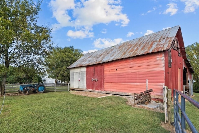 view of outbuilding with a lawn