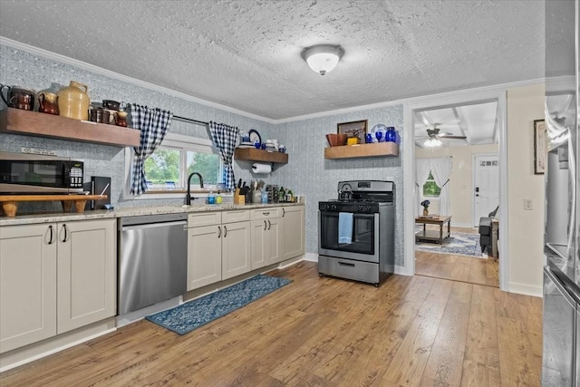 kitchen featuring white cabinetry, light wood-type flooring, crown molding, and appliances with stainless steel finishes