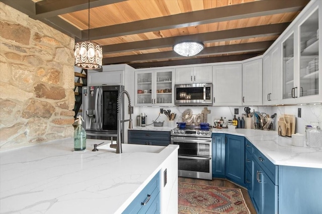 kitchen featuring appliances with stainless steel finishes, blue cabinets, beam ceiling, decorative light fixtures, and white cabinets