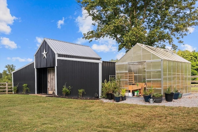 view of outdoor structure featuring a lawn