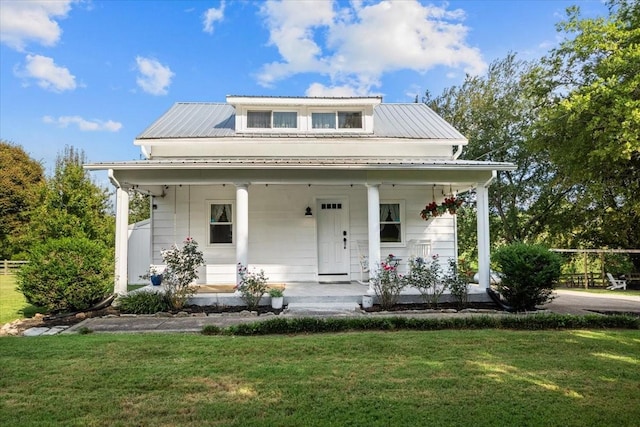 bungalow-style home with a front lawn