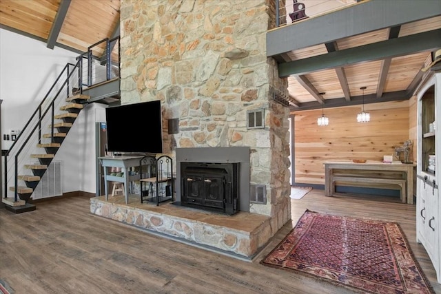 unfurnished living room with beamed ceiling, hardwood / wood-style floors, and wood ceiling