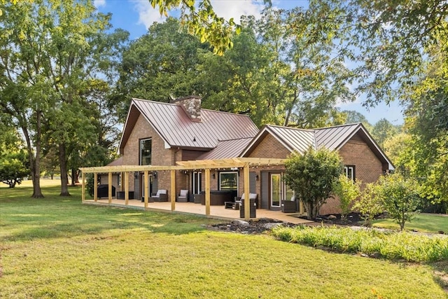 back of house with a patio area, a pergola, and a yard