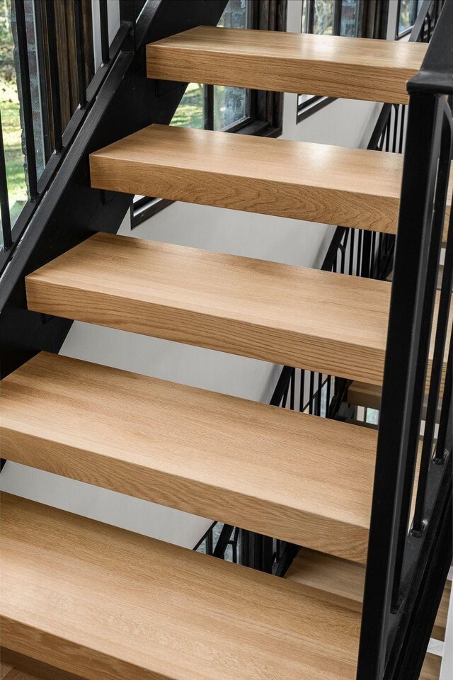 staircase with a wealth of natural light