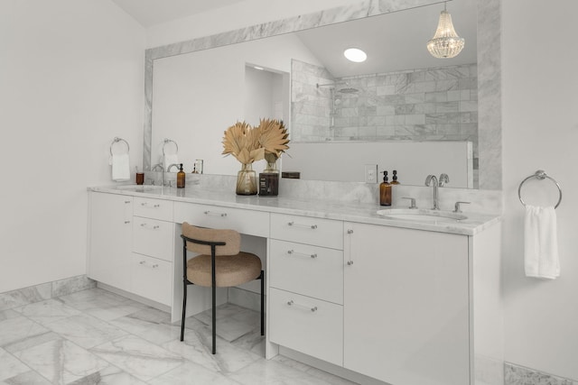 bathroom featuring vanity, vaulted ceiling, and tiled shower