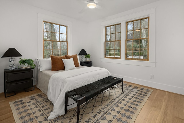 bedroom with wood-type flooring and ceiling fan