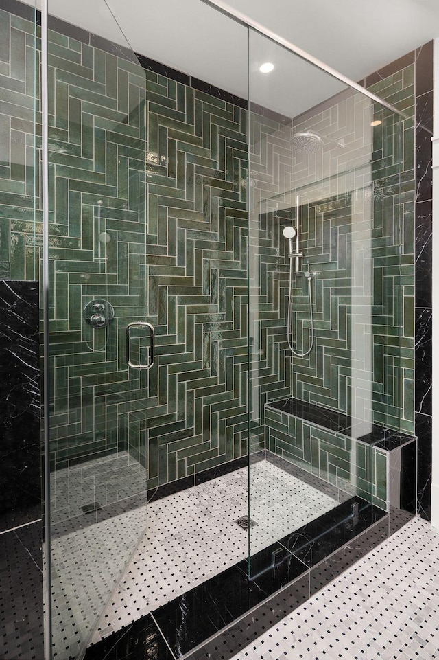 bathroom with a tile shower