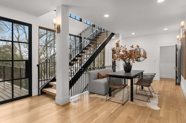 dining area featuring light hardwood / wood-style floors and a notable chandelier