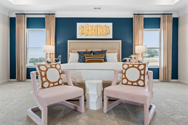 bedroom with carpet, crown molding, and multiple windows