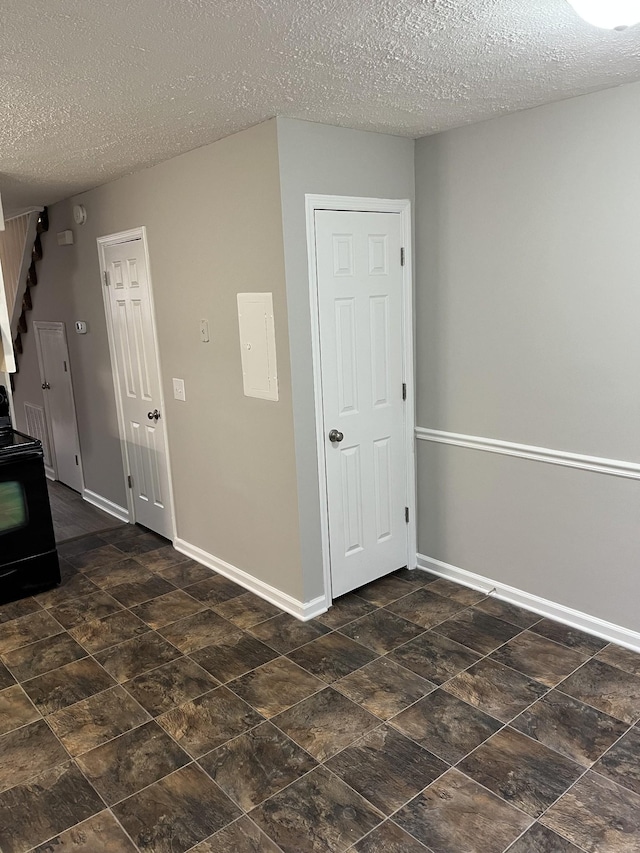 empty room with a textured ceiling