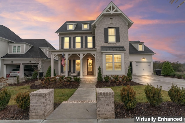 view of front of house with a garage and covered porch