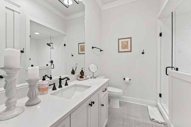 bathroom with crown molding, vanity, toilet, and a shower with door