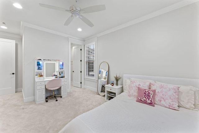 bedroom with ornamental molding, light colored carpet, and ceiling fan