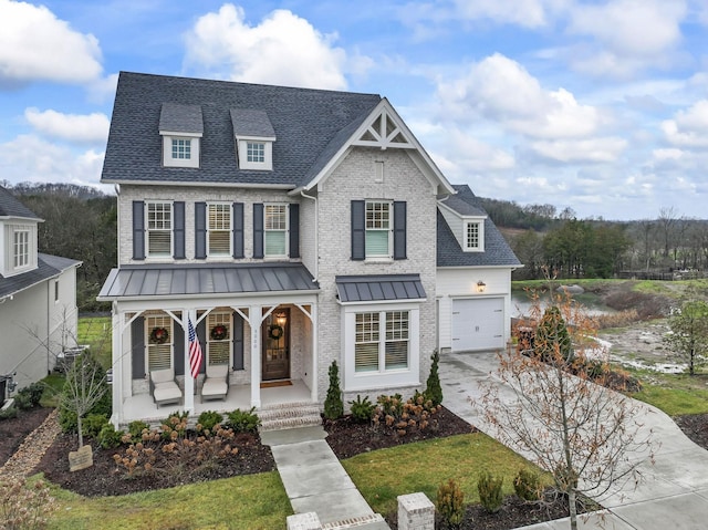 view of front of home with a porch and a garage