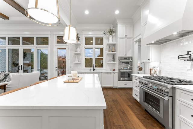 kitchen with white cabinetry, stainless steel appliances, a center island, and custom range hood