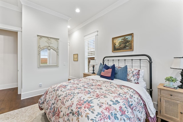 bedroom with multiple windows, crown molding, and dark hardwood / wood-style flooring