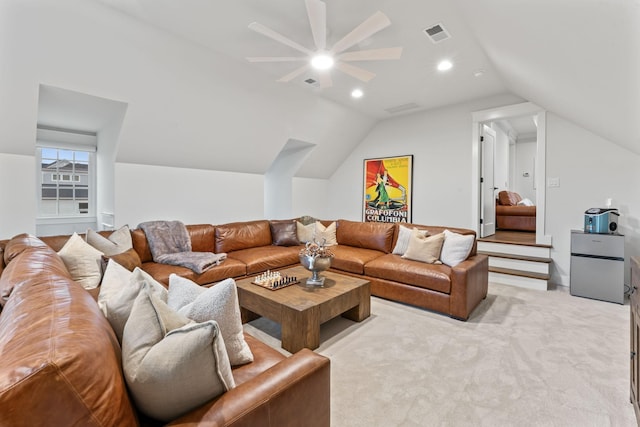 living room featuring lofted ceiling and light carpet