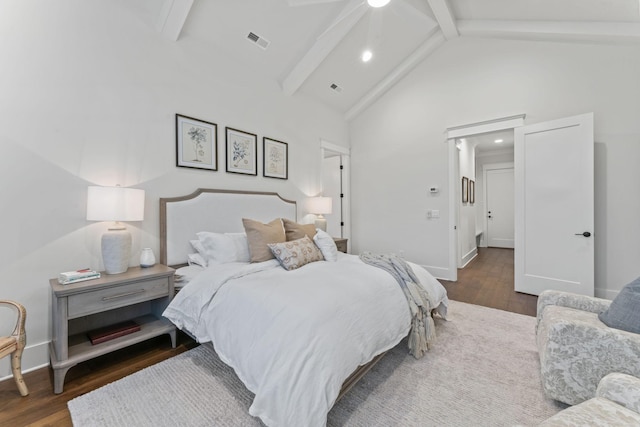 bedroom with beamed ceiling, high vaulted ceiling, and dark hardwood / wood-style flooring