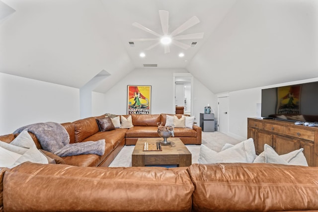 living room featuring light carpet and vaulted ceiling