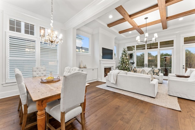 dining space with coffered ceiling, dark hardwood / wood-style flooring, a chandelier, and beam ceiling