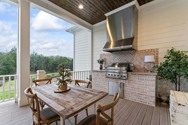 deck with grilling area and exterior kitchen