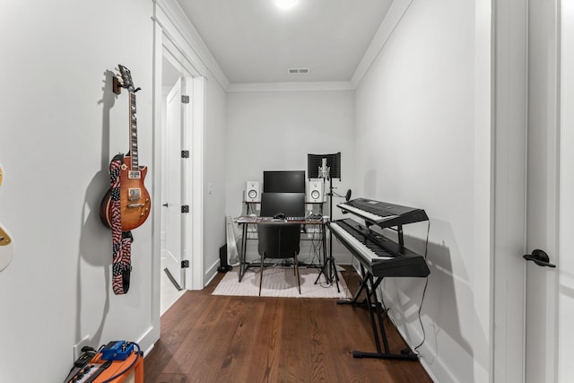 office space featuring dark hardwood / wood-style flooring and crown molding