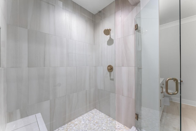 bathroom with a shower with door