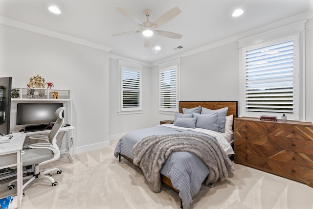 bedroom with crown molding, light colored carpet, and ceiling fan