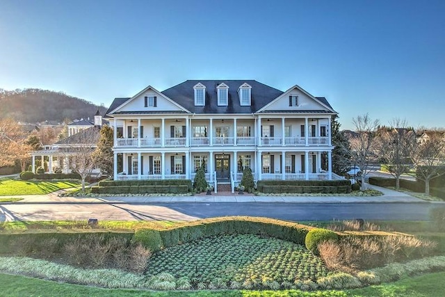 view of front of house featuring a balcony