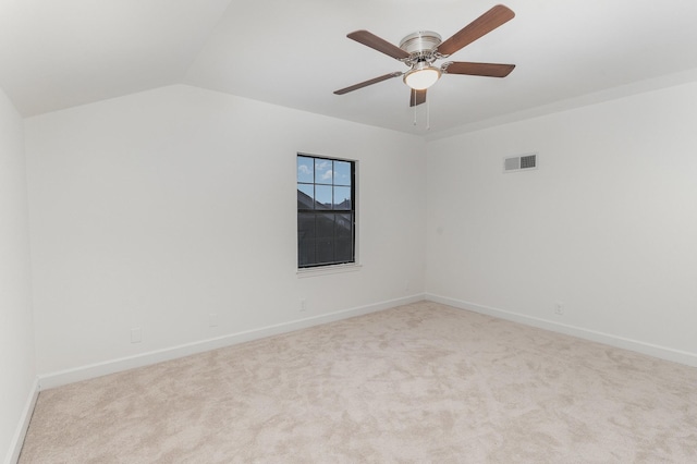 empty room with light carpet, ceiling fan, and lofted ceiling