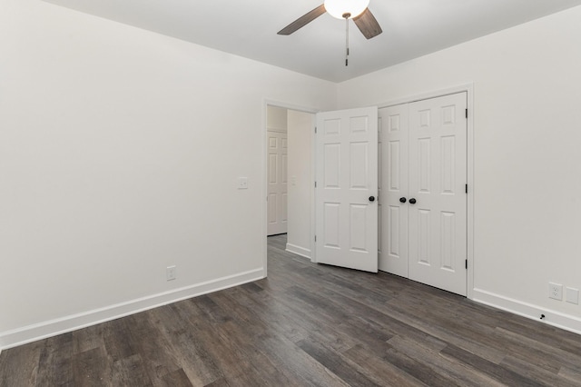 unfurnished bedroom with a closet, ceiling fan, and dark hardwood / wood-style flooring